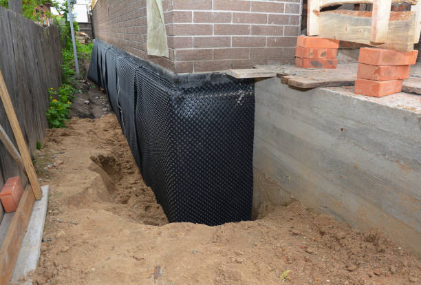 Happy homeowners after waterproofing job in East Lansing